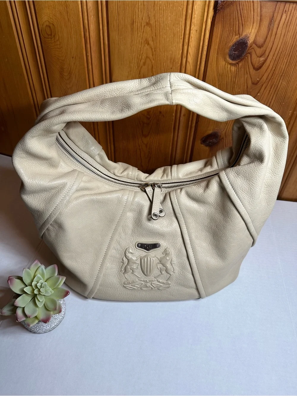 Cream Leather Shoulder Hobo Bag with Embossed Crest